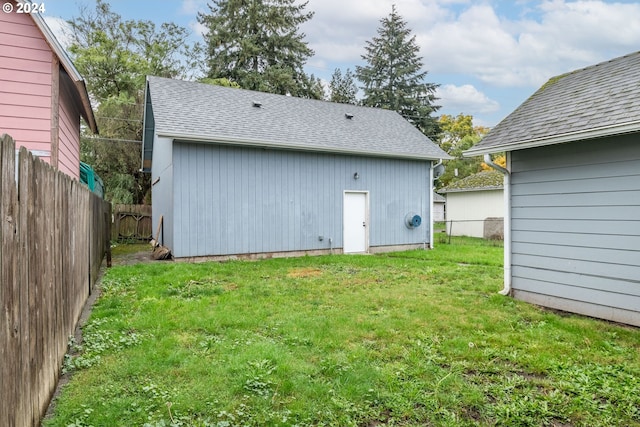 back of property featuring a yard