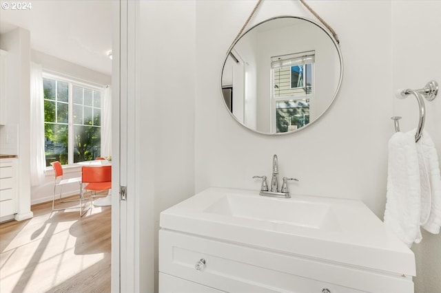 bathroom featuring vanity and hardwood / wood-style floors