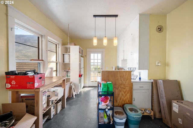 kitchen with white cabinets and pendant lighting