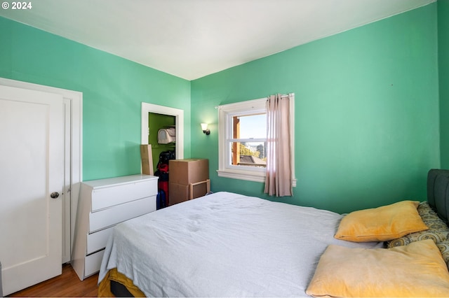 bedroom with hardwood / wood-style floors