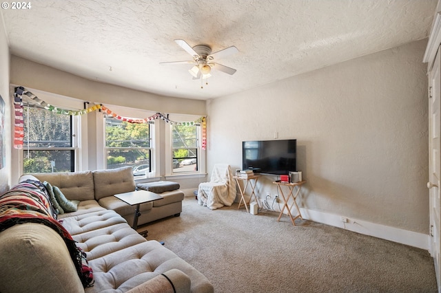 living room with a textured ceiling, carpet floors, and ceiling fan