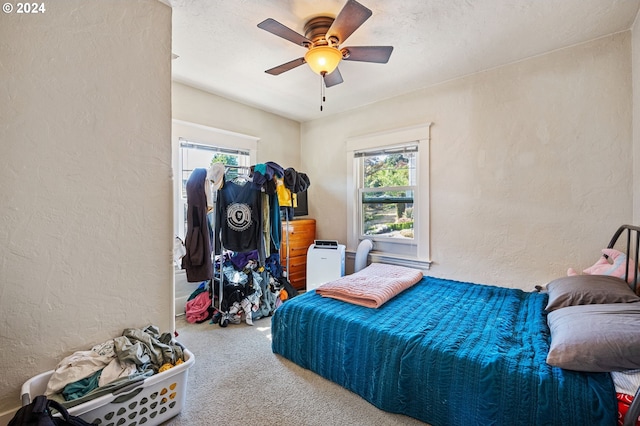 bedroom featuring ceiling fan and carpet floors