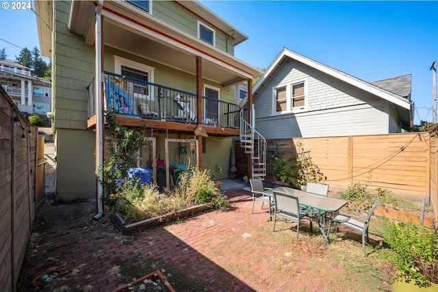 rear view of property featuring a patio area