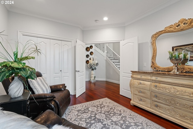 sitting room with crown molding and dark hardwood / wood-style flooring