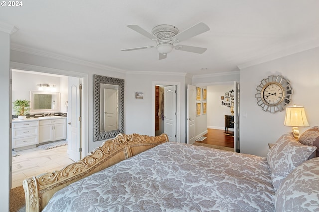 bedroom featuring ceiling fan, ornamental molding, sink, and connected bathroom