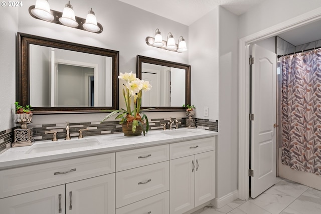 bathroom with decorative backsplash and vanity