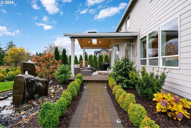 exterior space featuring an outdoor hangout area and a patio