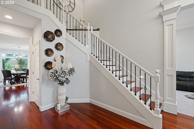 stairway with hardwood / wood-style flooring