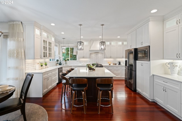 kitchen featuring white cabinetry, dark hardwood / wood-style flooring, and a kitchen island