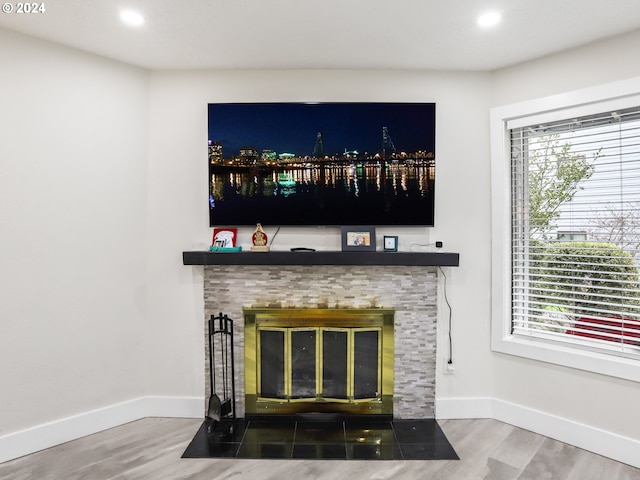 room details featuring dark wood-type flooring and a fireplace