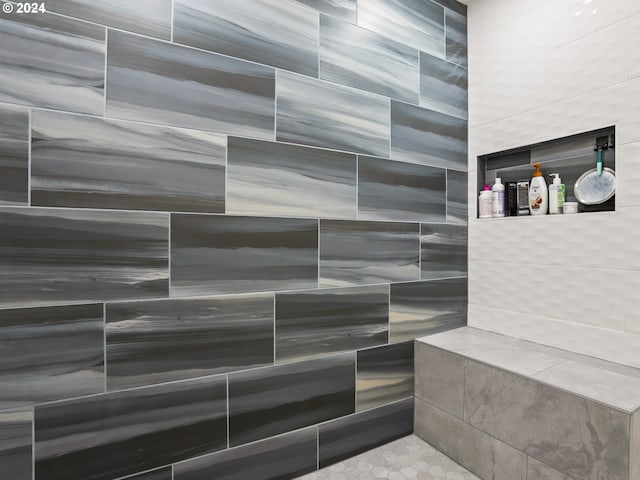 bathroom featuring tiled shower