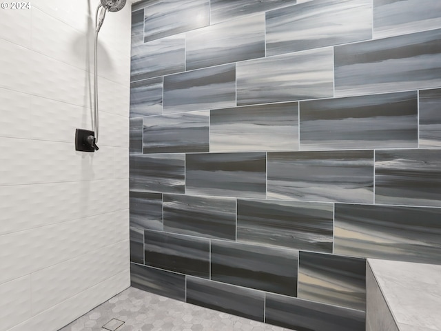 bathroom with a tile shower