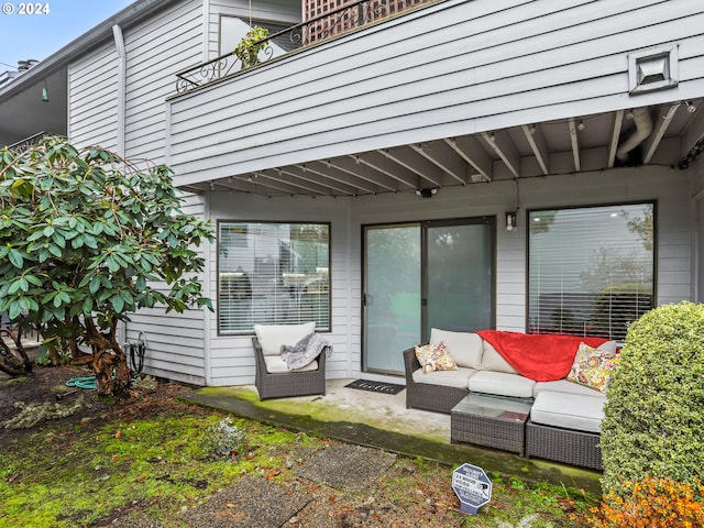 exterior space with outdoor lounge area and a balcony