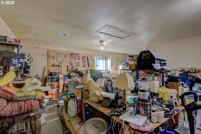 miscellaneous room featuring a textured ceiling