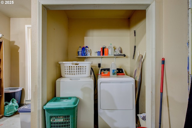 clothes washing area featuring washer and clothes dryer