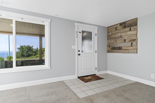 3660 Rocky Creek Ave, Depoe Bay, OR 97341 - tiled entrance foyer featuring baseboards and carpet