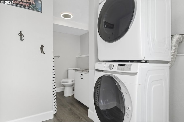 3660 Rocky Creek Ave, Depoe Bay, OR 97341 - clothes washing area with stacked washer / dryer and dark wood-style flooring