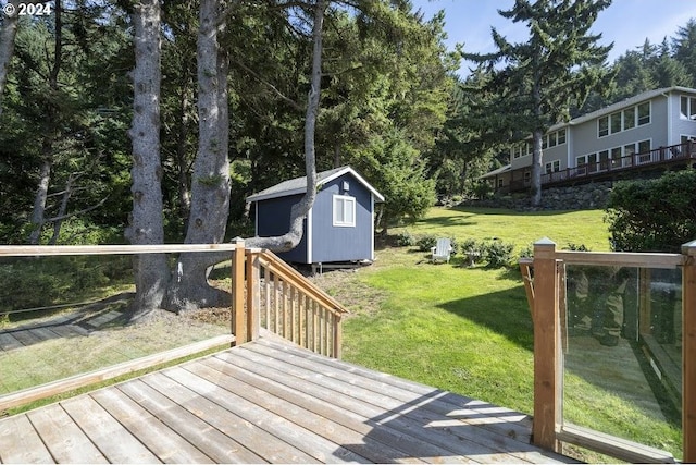 3660 Rocky Creek Ave, Depoe Bay, OR 97341 - wooden deck with a shed, an outdoor structure, a lawn, and view of wooded area