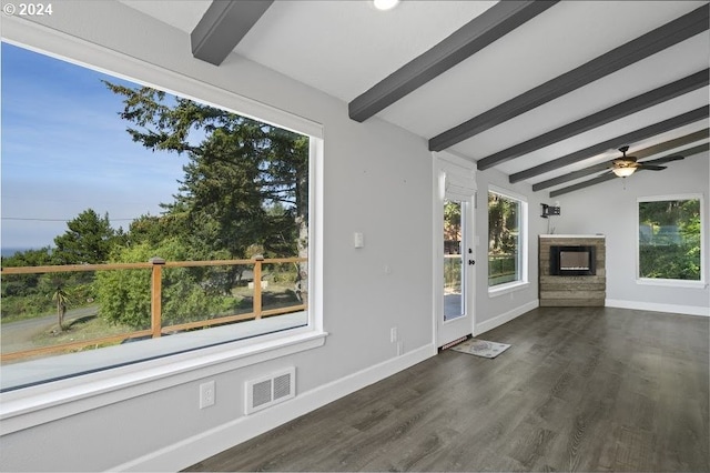 3660 Rocky Creek Ave, Depoe Bay, OR 97341 - unfurnished living room with baseboards, a fireplace, a ceiling fan, and dark wood-type flooring
