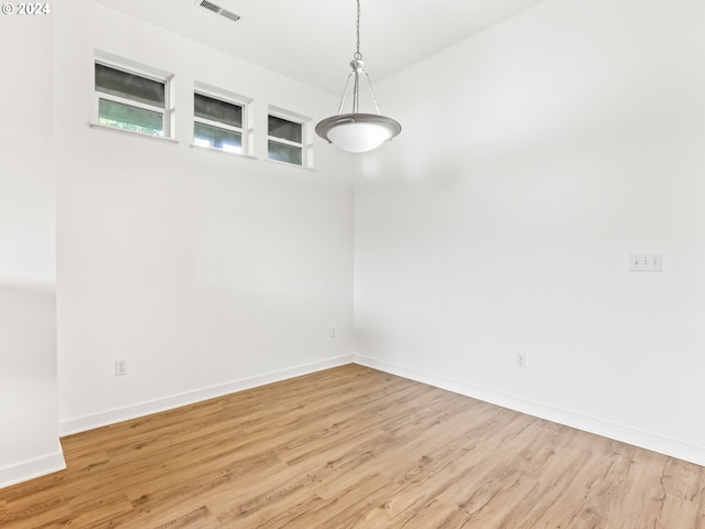 empty room with light wood-type flooring