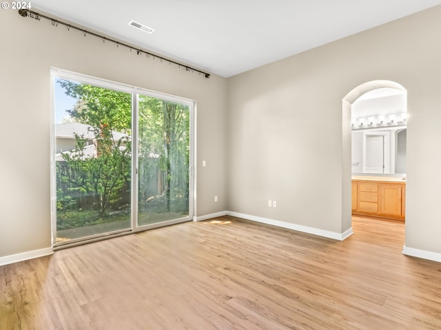 unfurnished room featuring light wood-type flooring