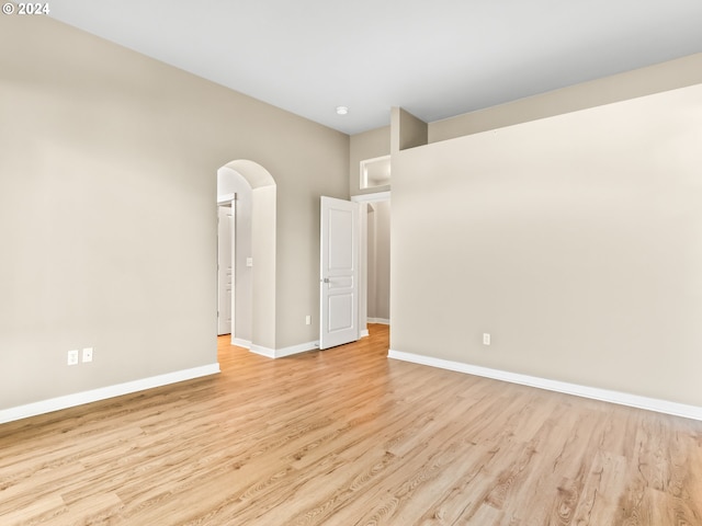 spare room with light wood-type flooring