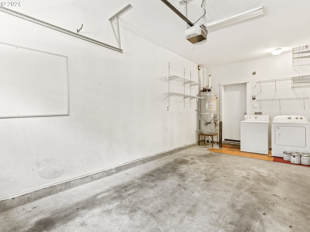 garage featuring independent washer and dryer, a garage door opener, and water heater