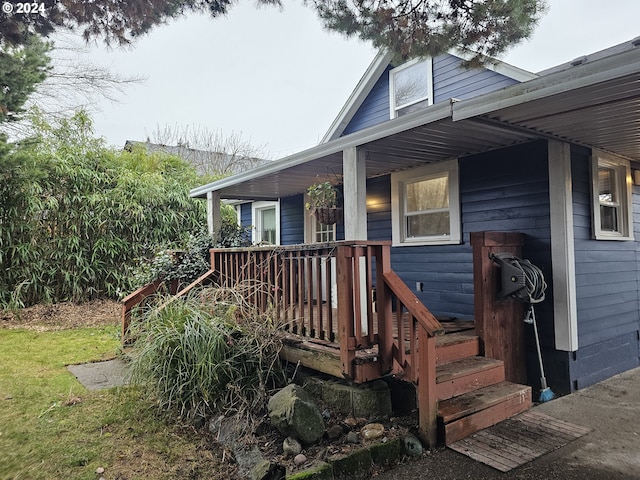 wooden terrace featuring covered porch