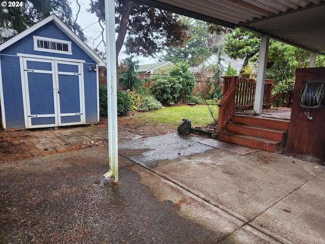 view of patio / terrace featuring a storage unit