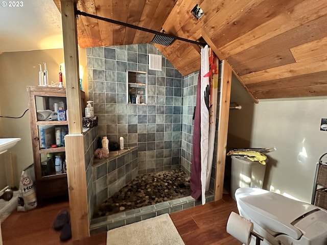 bathroom featuring hardwood / wood-style flooring, lofted ceiling, curtained shower, and wooden ceiling