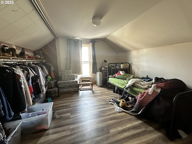 bonus room featuring vaulted ceiling and hardwood / wood-style floors