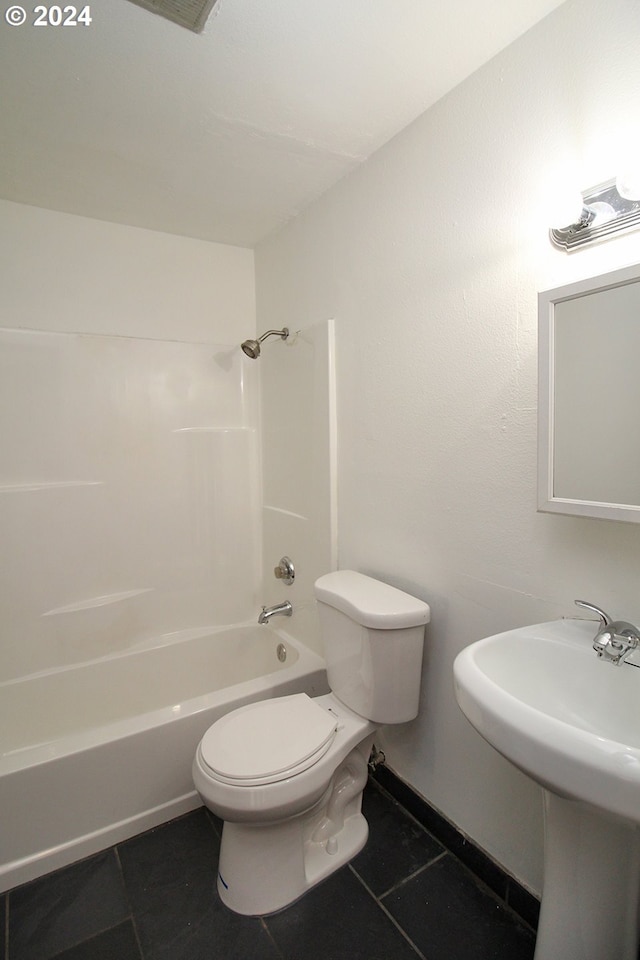 bathroom featuring tile patterned flooring,  shower combination, and toilet