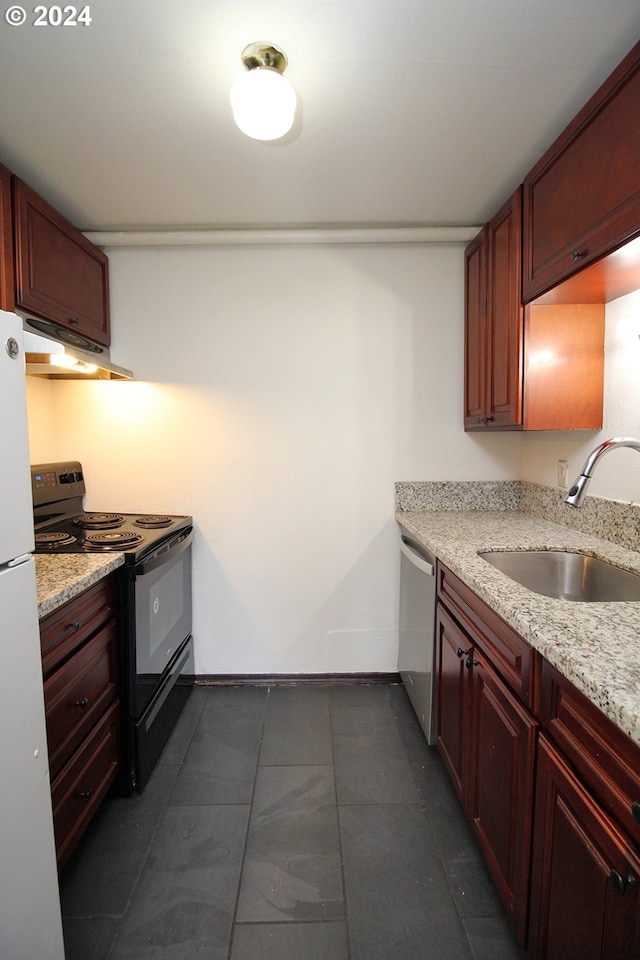 kitchen with sink, light stone counters, stainless steel dishwasher, black range with electric cooktop, and white fridge