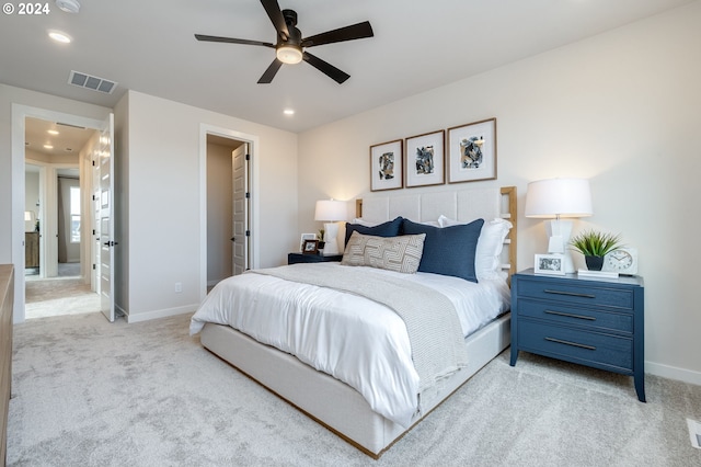 bedroom featuring light colored carpet and ceiling fan