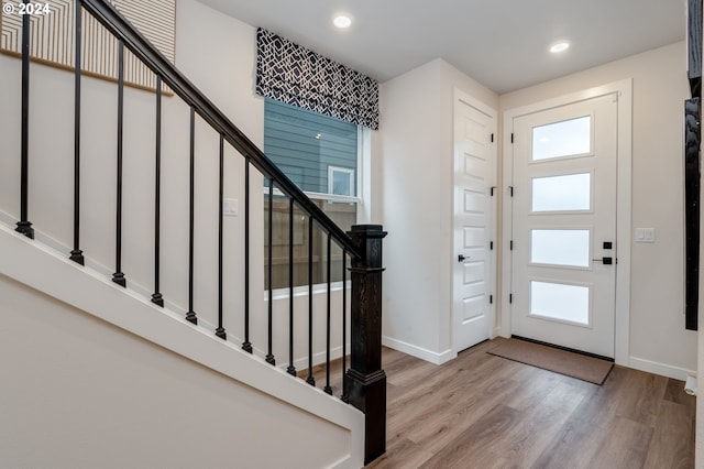 foyer entrance with light hardwood / wood-style flooring