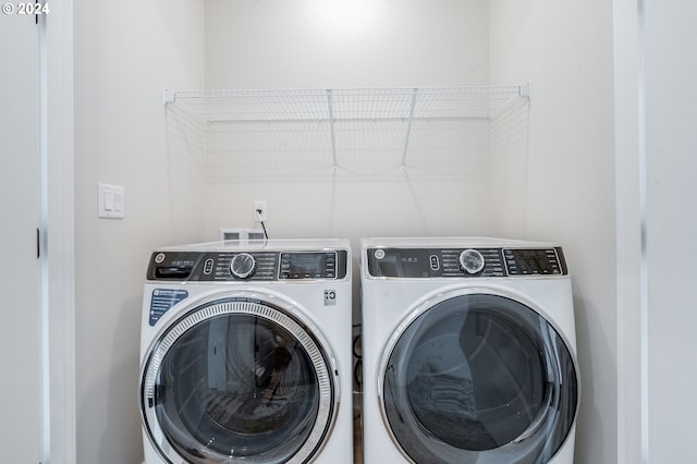 laundry area with washer and dryer