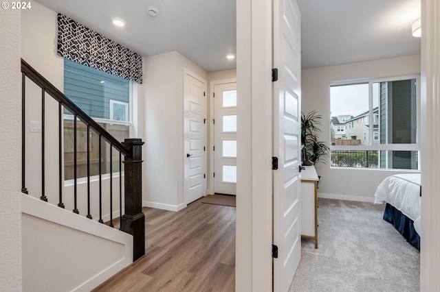 foyer with light hardwood / wood-style floors