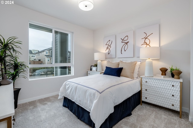 bedroom with light carpet