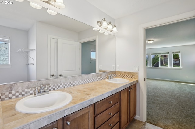 bathroom featuring backsplash and vanity