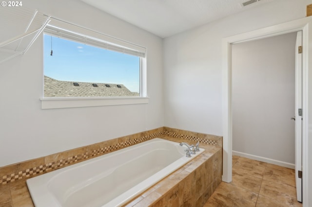 bathroom with tiled tub