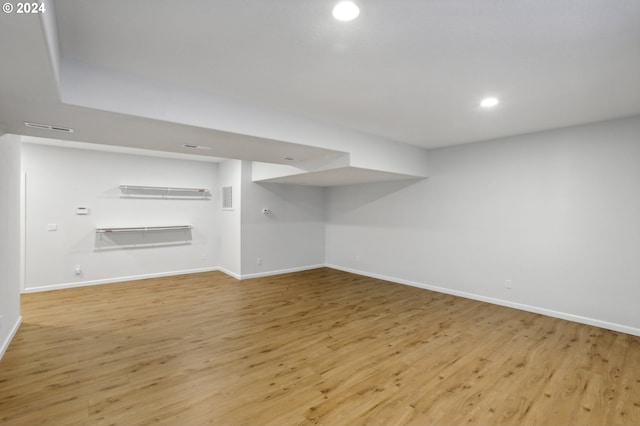 basement featuring light wood-type flooring