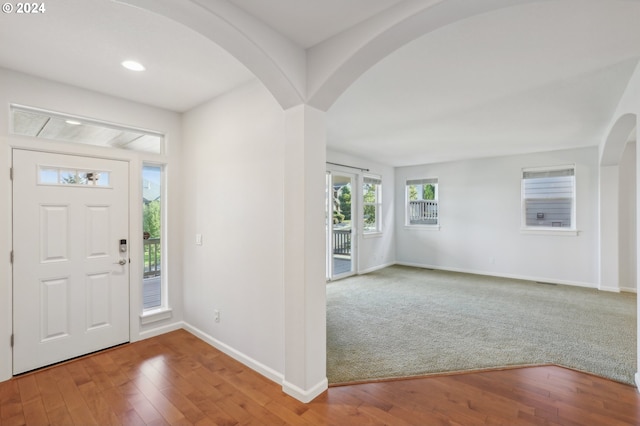 view of carpeted foyer entrance