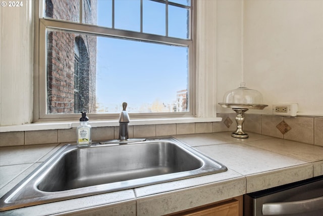 interior details featuring sink and stainless steel dishwasher