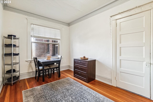 office space with crown molding and wood-type flooring