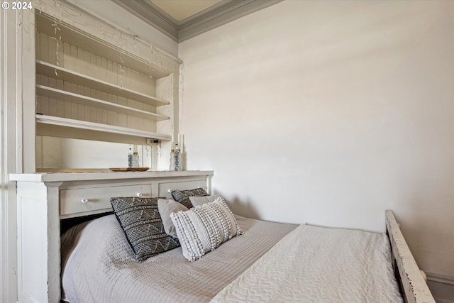 bedroom featuring crown molding