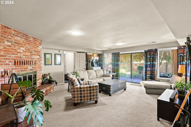 carpeted living room with brick wall, a textured ceiling, and a fireplace