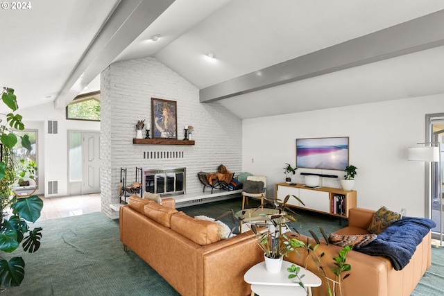 living room featuring brick wall, lofted ceiling with beams, a fireplace, and carpet floors