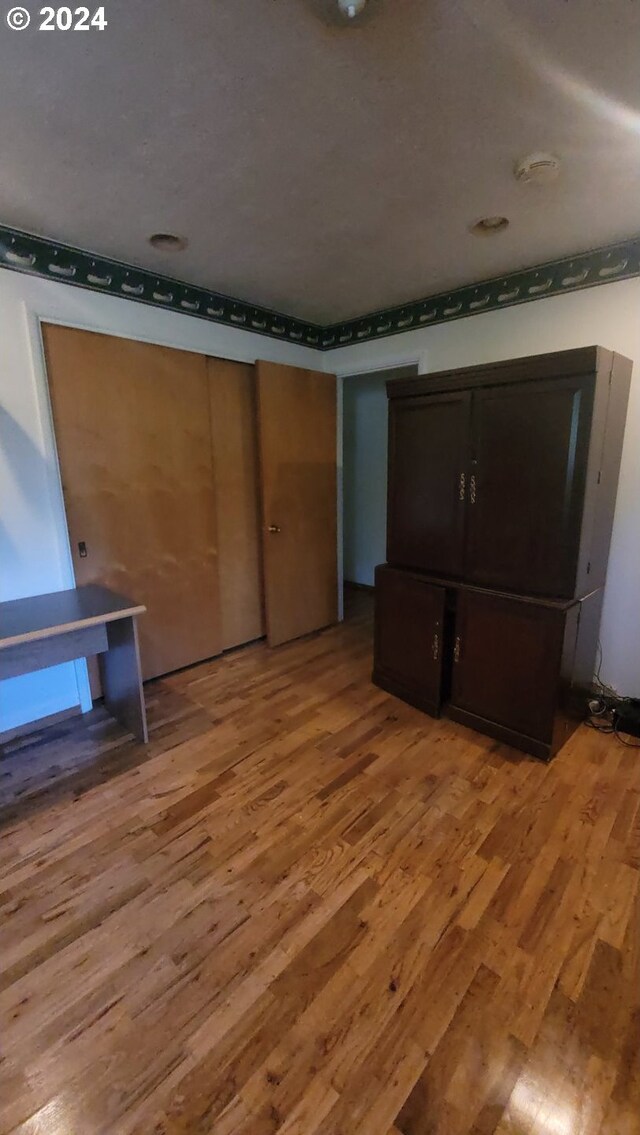 unfurnished bedroom featuring hardwood / wood-style floors