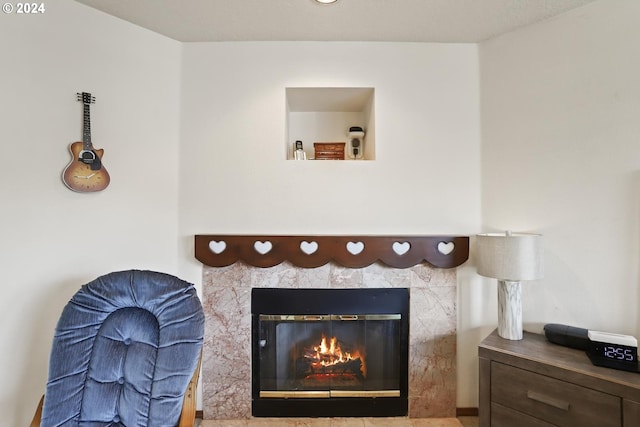 room details featuring a tiled fireplace