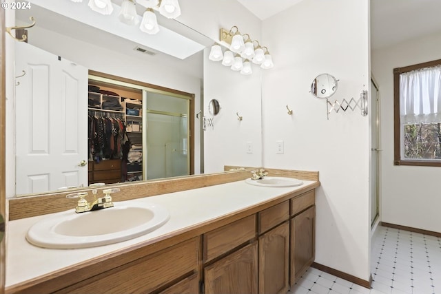 bathroom featuring vanity and a shower with shower door